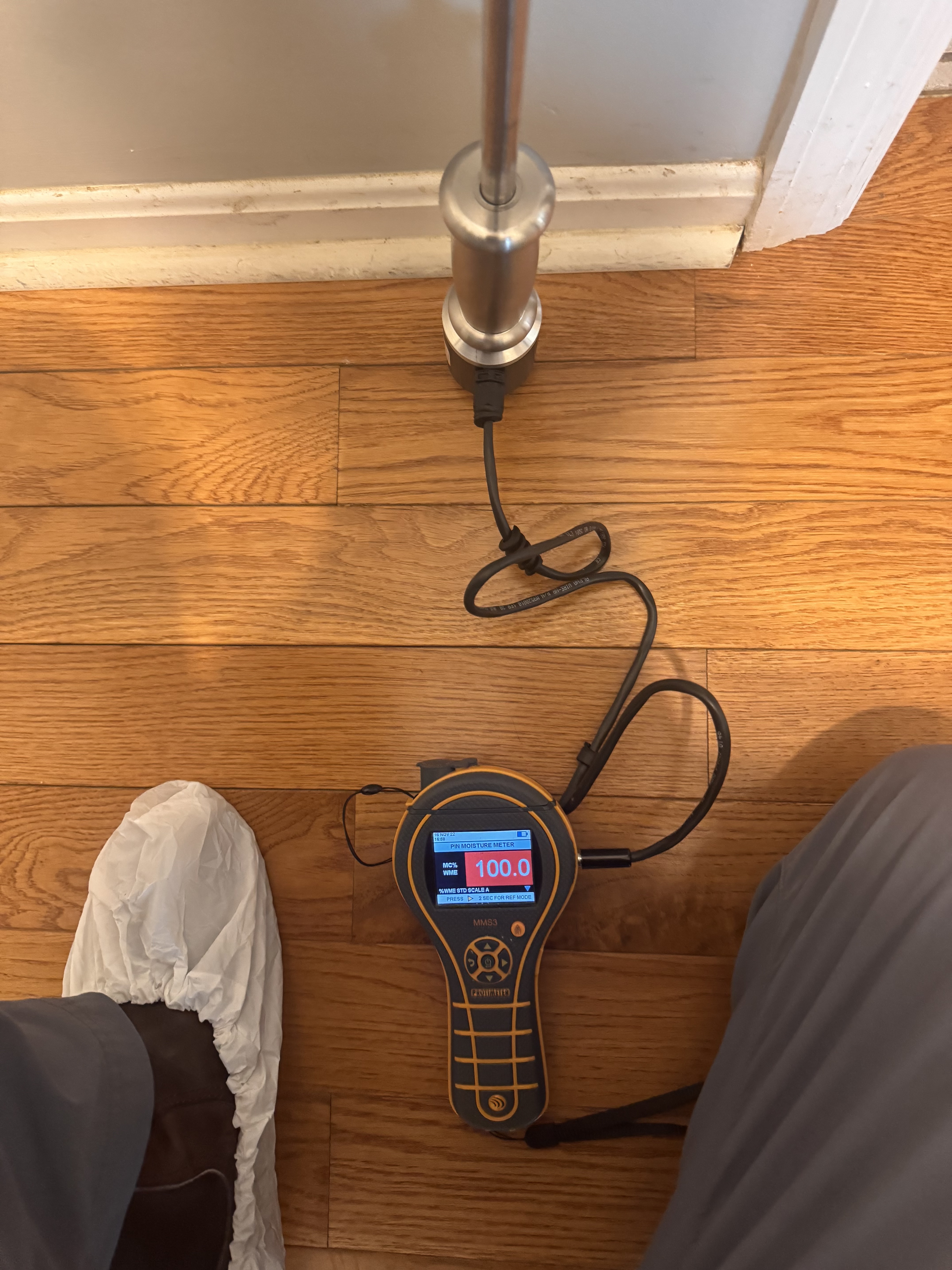 IRS technician using moisture meter to map water damage in a Las Vegas home
