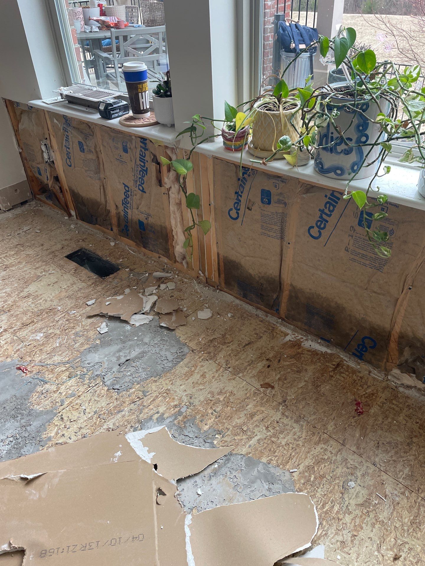 Damaged wall insulation and subfloor after storm damage in Las Vegas