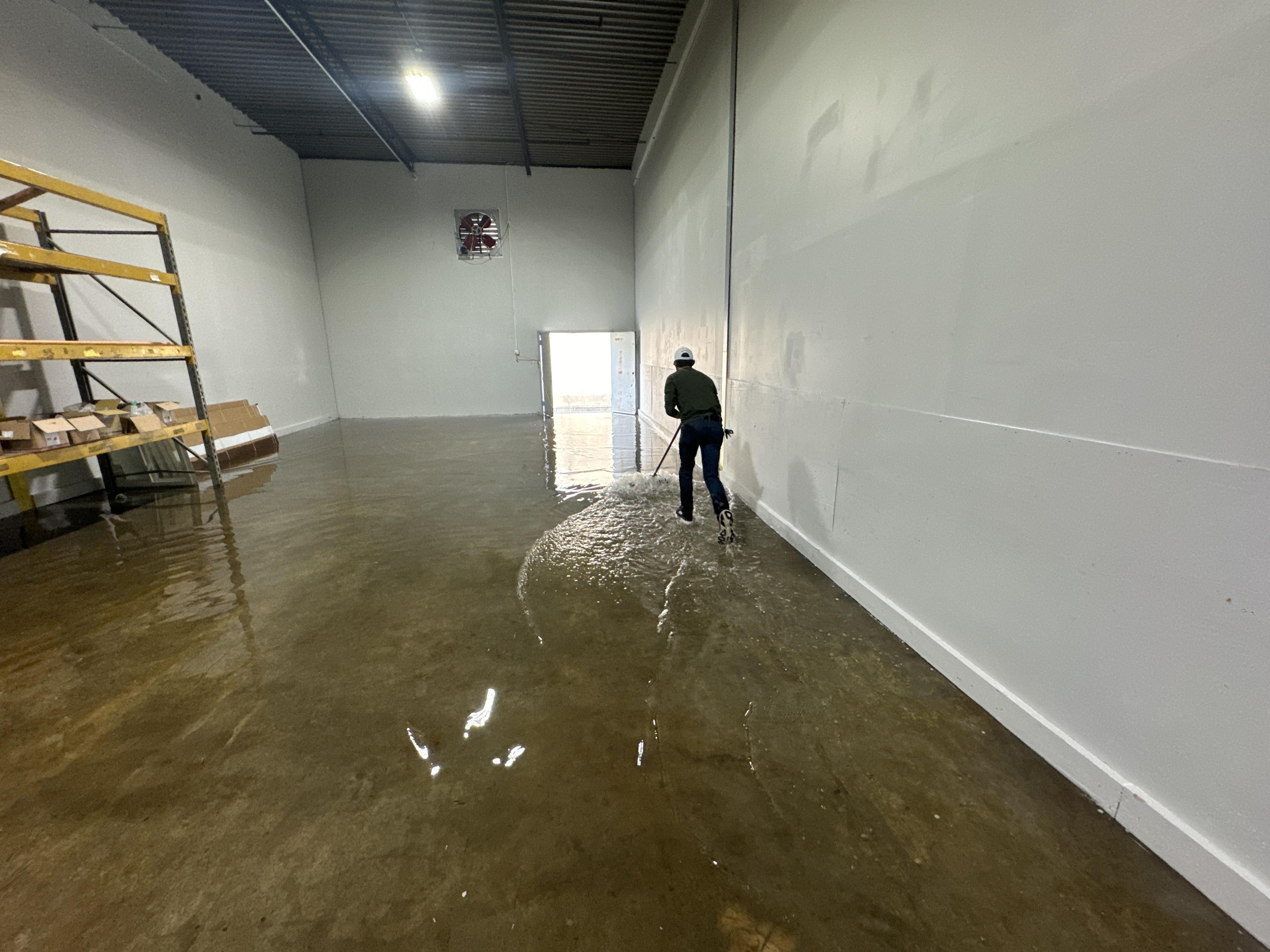 IRS crew member extracting standing water from a Las Vegas commercial building