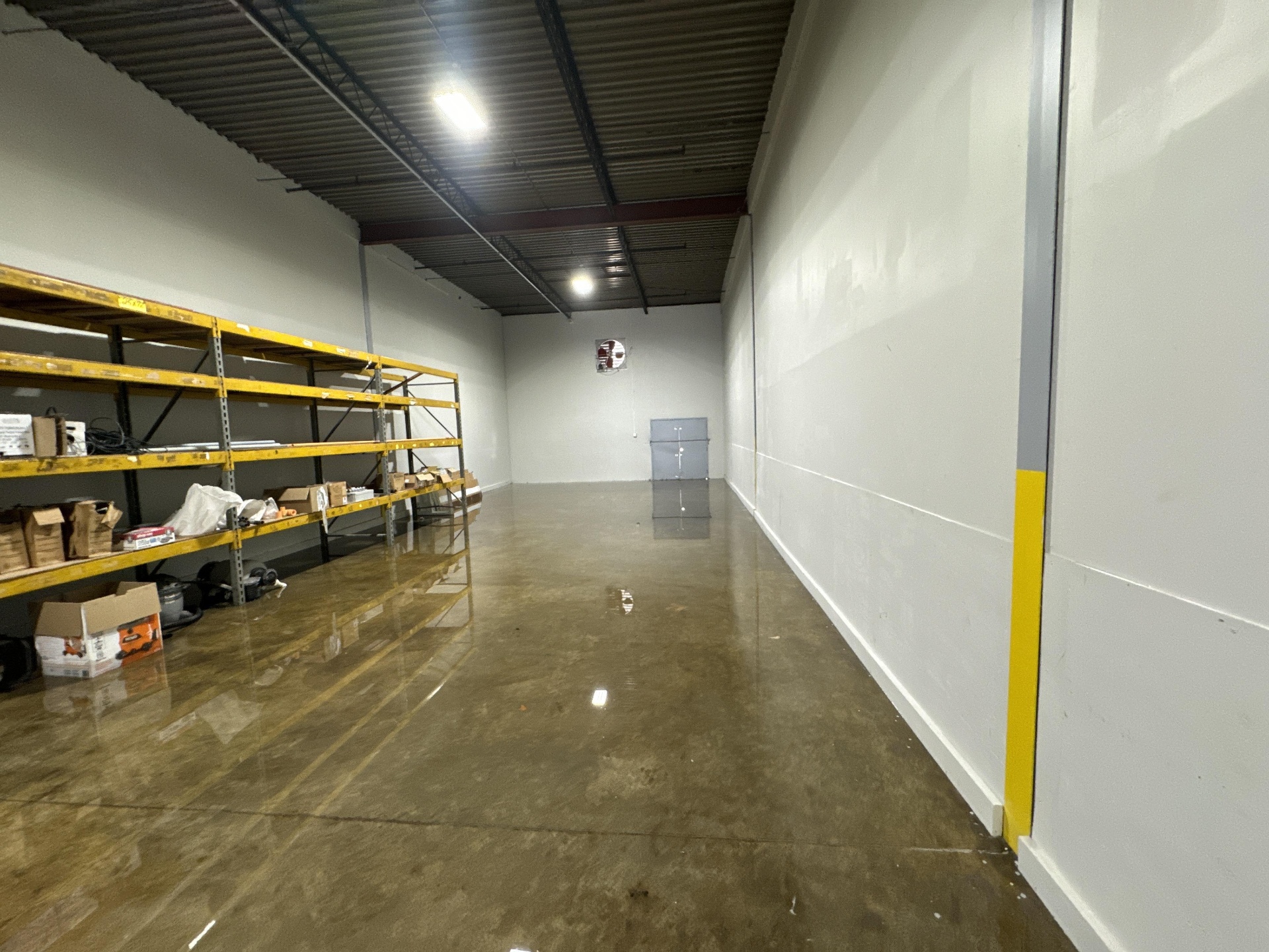 Flooded warehouse shelving with damaged inventory in Las Vegas